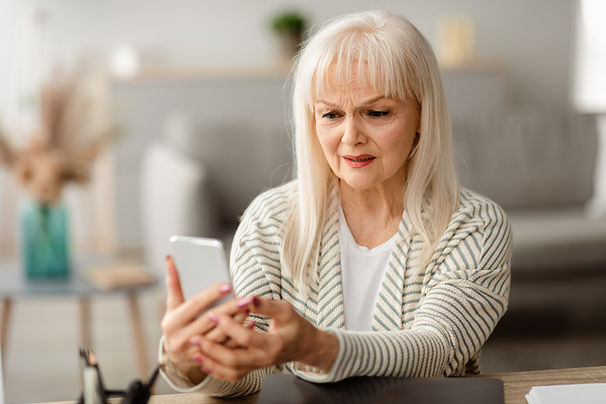 Older woman looking at phone