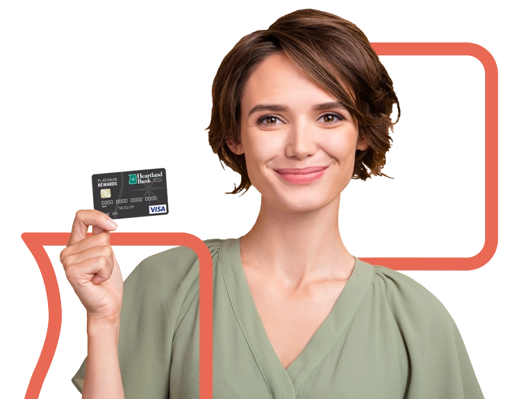 Young adult woman holding Heartland Bank and Trust Company Credit Card