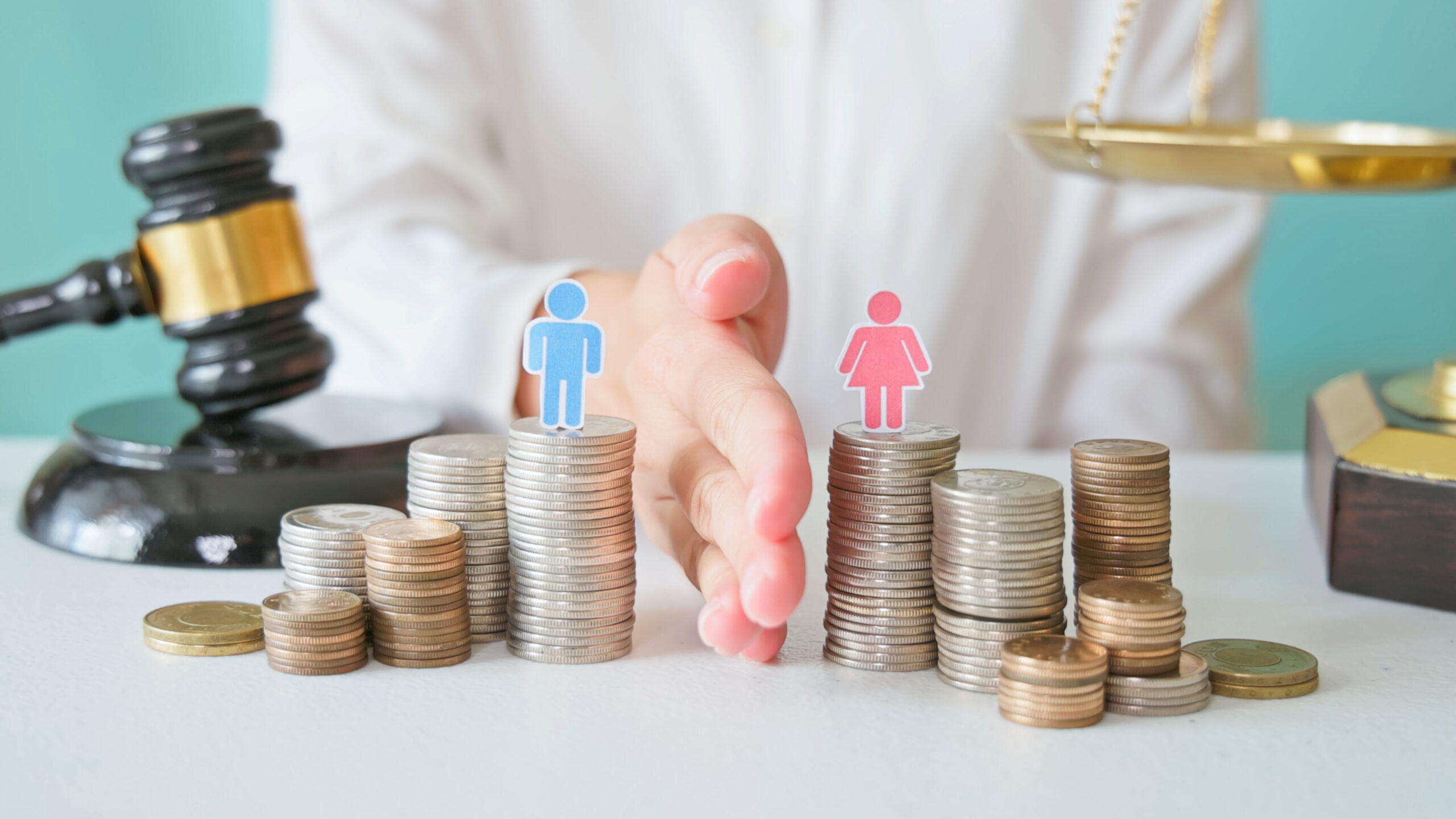 Savings Bond Beneficiary Designation 1 Close-up of hands dividing coins into separate stacks symbolizing divorce and property division.