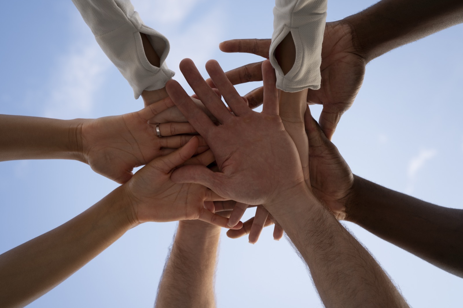 Man holding a credit card and piggy bank
